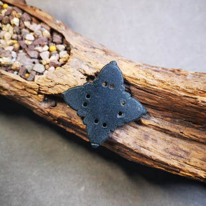 Hand Carved Cross Vajra Amulet Badge, Tibetan Buddhist Pendant, Made of Obsidian - Tibetan Buddhist amulet, close-up detail