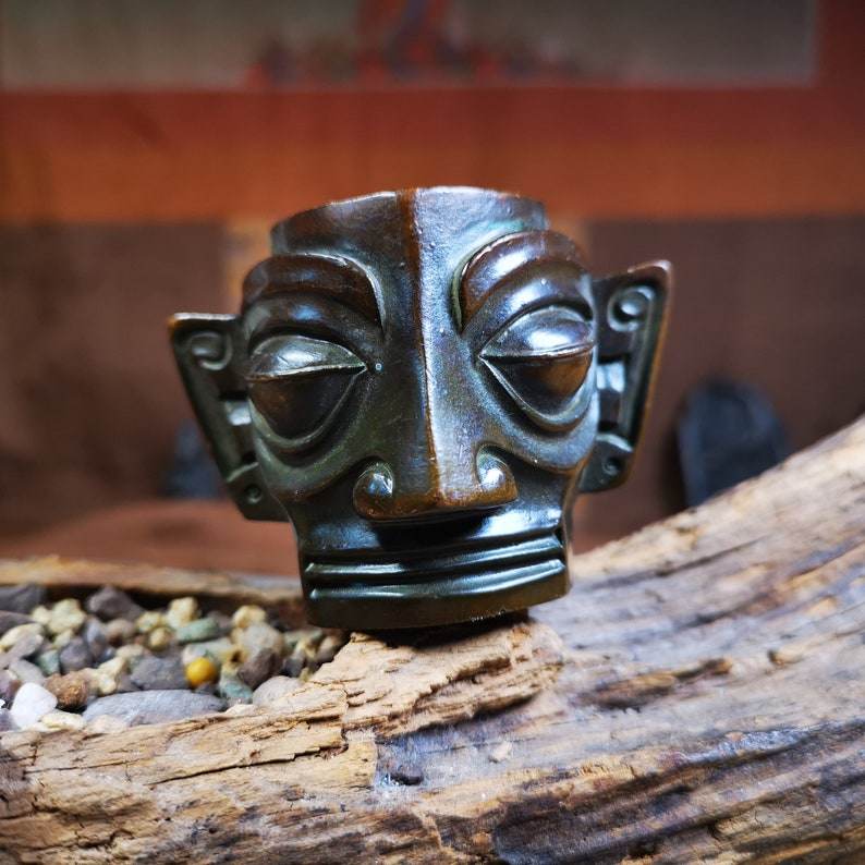 Replica Bronze Head Mask from Sanxingdui Ruins - Tibetan Buddhist art, close-up detail