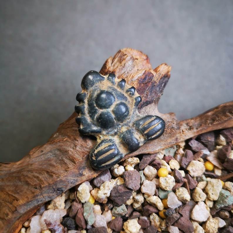 Buddhist Amulet Badge,Triratna,Mani Jewel/Wish-Fulfilling Cintamani,Nandipada Pe - Tibetan Buddhist amulet, close-up detail
