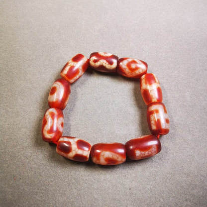 Fire Agate Dzi Bead Bracelet - Tibetan Buddhist mala beads, close-up detail