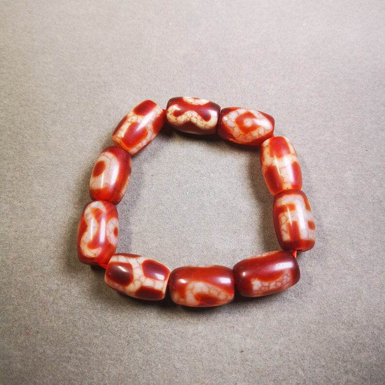 Fire Agate Dzi Bead Bracelet - Tibetan Buddhist mala beads, close-up detail