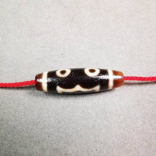 3 Eyed Dzi Bead - Tibetan dzi bead, front view