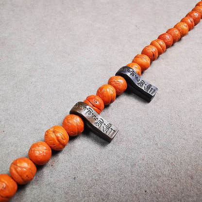 Thokcha Mala Counter Clip,Om Mani Padme Hum - Tibetan Buddhist mala beads, close-up detail