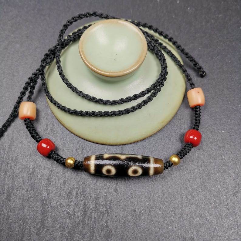 3 Eyes Dzi Bead Amulet,Protection Jewelry - Tibetan dzi bead, close-up detail