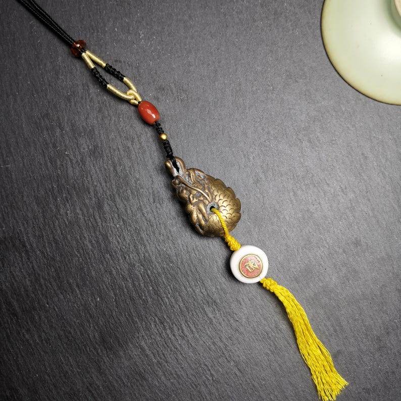 Amulet, Dragon Charm Pendant - Tibetan Buddhist amulet, detailed view