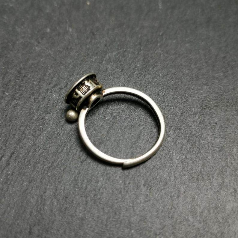 Silver Prayer Wheel Ring - Tibetan Buddhist art, close-up detail