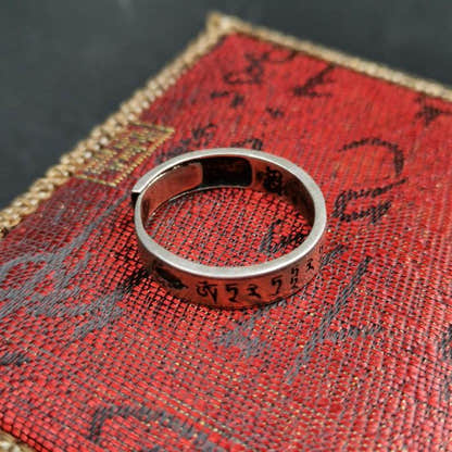 Silver Ring - Tibetan Buddhist art, close-up detail
