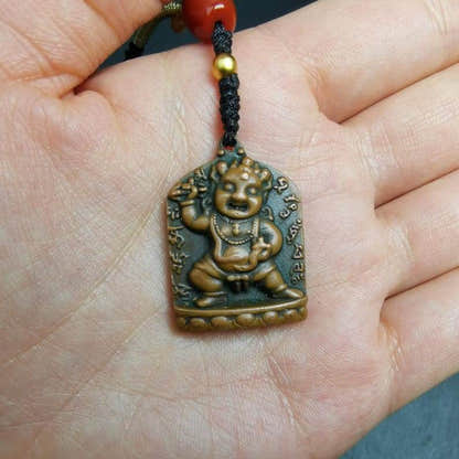 Statue Pendant,Vajrapani Amulet Badge - Tibetan Buddhist amulet, close-up detail