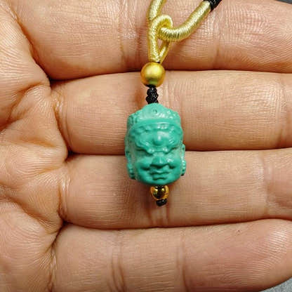 Turquoise Mahakala Amulet - Tibetan Buddhist amulet, close-up detail