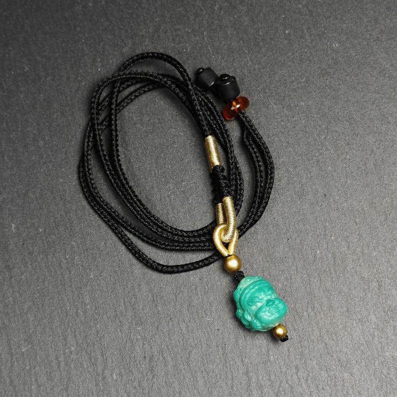 Turquoise Mahakala Amulet - Tibetan Buddhist amulet, detailed view