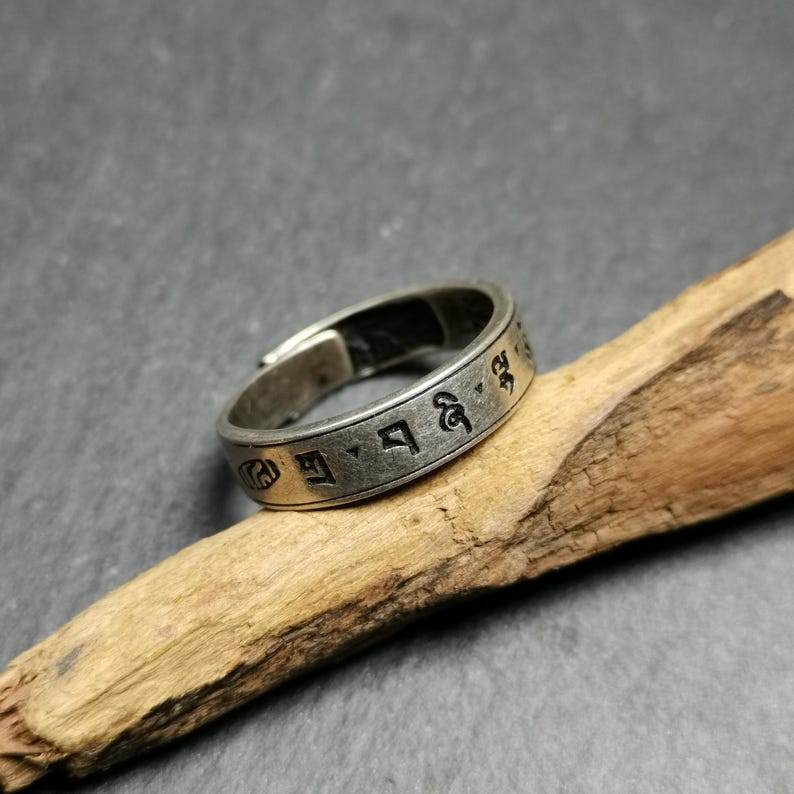 Silver Ring - Tibetan Buddhist art, close-up detail