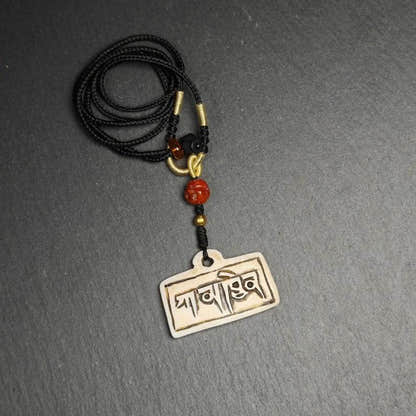Amulet Badge with Tibetan Letters Karmapa - Tibetan Buddhist amulet, detailed view