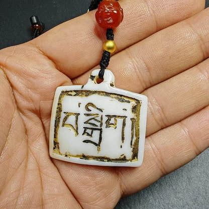 Amulet Badge with Tibetan Letters - Tibetan Buddhist amulet, detailed view