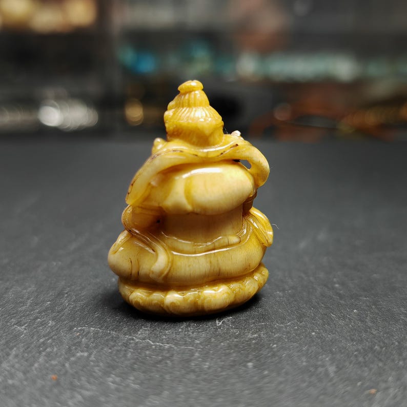 Gandhanra Antique Consecrated Tibetan Buddha statue - Yellow Jambhala(Dzambhala),Carved from Deer Antlers,40mm × 30mm × 20mm