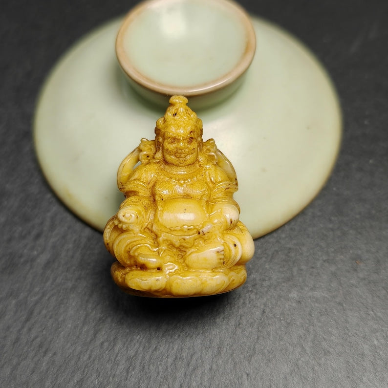 Gandhanra Antique Consecrated Tibetan Buddha statue - Yellow Jambhala(Dzambhala),Carved from Deer Antlers,40mm × 30mm × 20mm