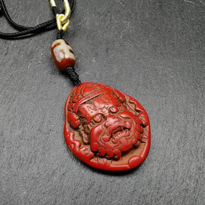 Old Cinnabar Mahakala Amulet with Dzi Bead - Tibetan dzi bead, front view