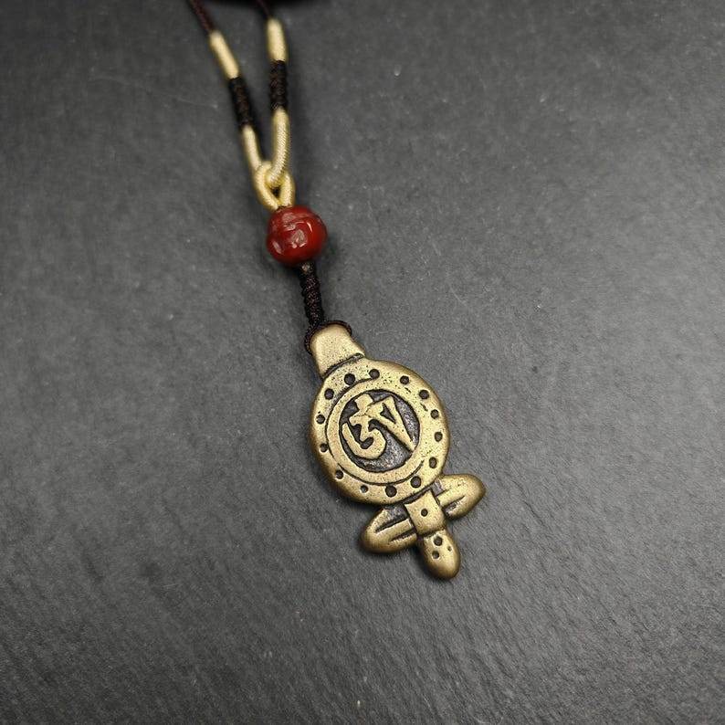 Tibetan Buddhism Amulet - Vajra Pendant with OM Symbol - Tibetan Buddhist amulet, detailed view