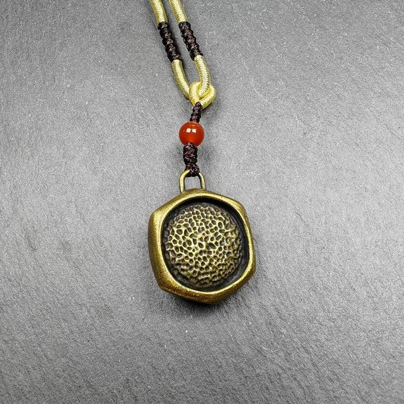 Double Faced Drashi Lhamo Amulet,Zashi Lhamo Pendant - Tibetan Buddhist amulet, detailed view