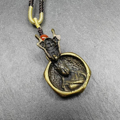 Double Faced Drashi Lhamo Amulet,Zashi Lhamo Pendant - Tibetan Buddhist amulet, close-up detail