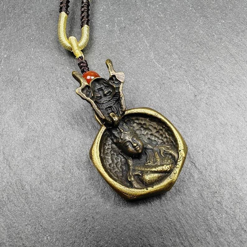 Double Faced Drashi Lhamo Amulet,Zashi Lhamo Pendant - Tibetan Buddhist amulet, close-up detail