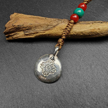 Calendar Badge,Melong Mirror, SIPAHO Amulet - Tibetan Buddhist amulet, close-up detail