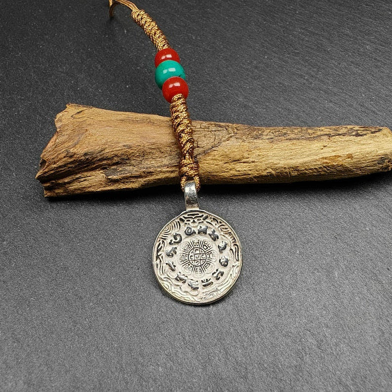 Calendar Badge,Melong Mirror, SIPAHO Amulet - Tibetan Buddhist amulet, front view