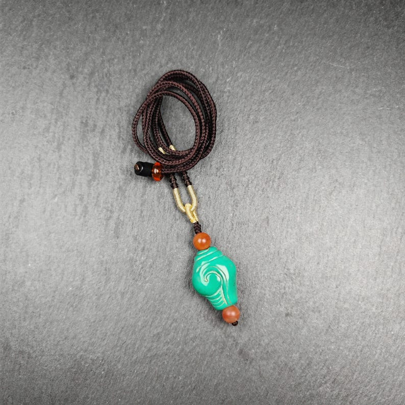 Shankha Amulet,Hand Carved Turquoise Conch Shell Pendant,25 - Tibetan Buddhist amulet, front view