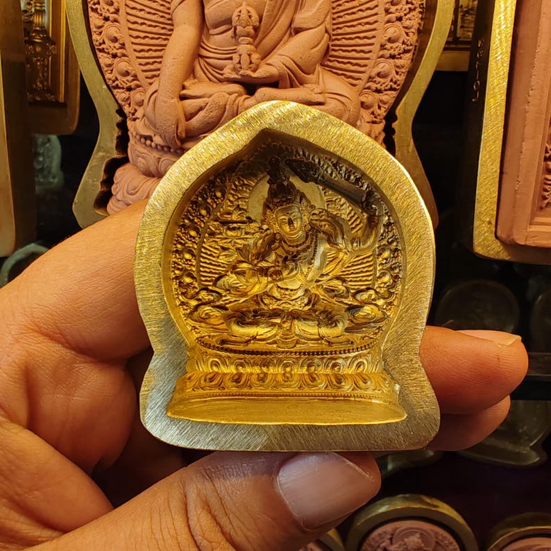 Yellow Manjusri Tsa Tsa Mold - Tibetan tsa tsa mold, detailed view