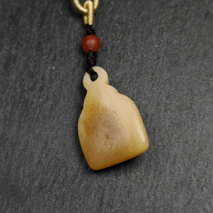 Buddhist Amulet | Copper Chenrezig Badge in Yak Bone Frame