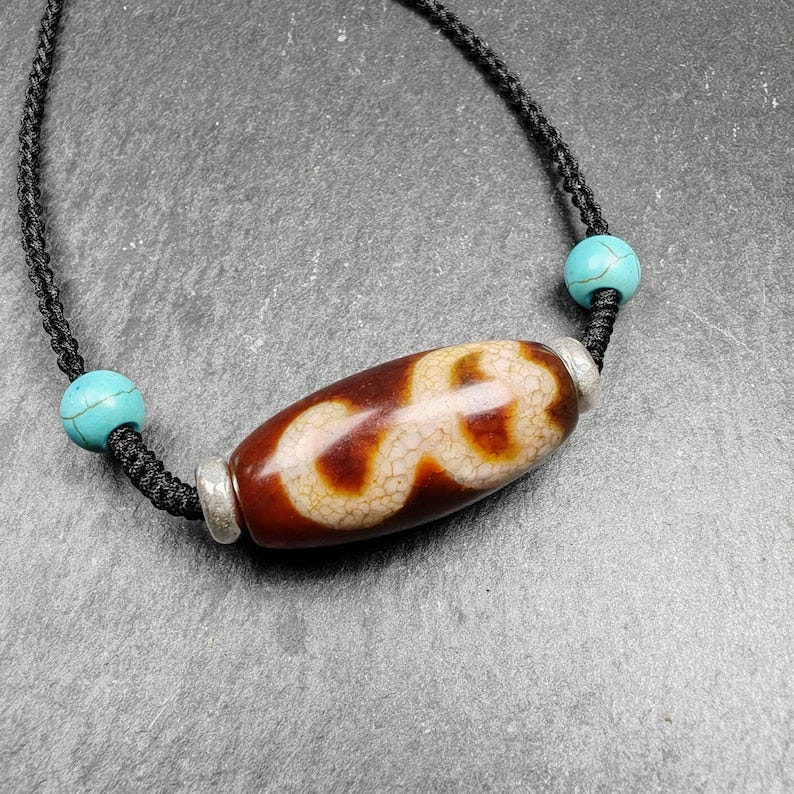 Fire Agate Lotus Dzi Amulet 31 - Tibetan dzi bead, detailed view