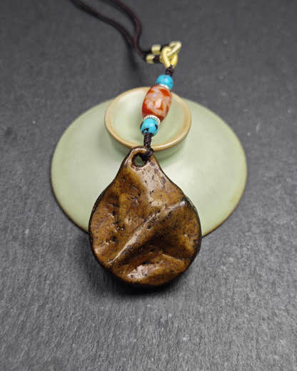 Authentic Kapala Amulet - Cross Vajra Charm - Tibetan Protective Pendant - Decad - Tibetan Buddhist amulet, close-up detail