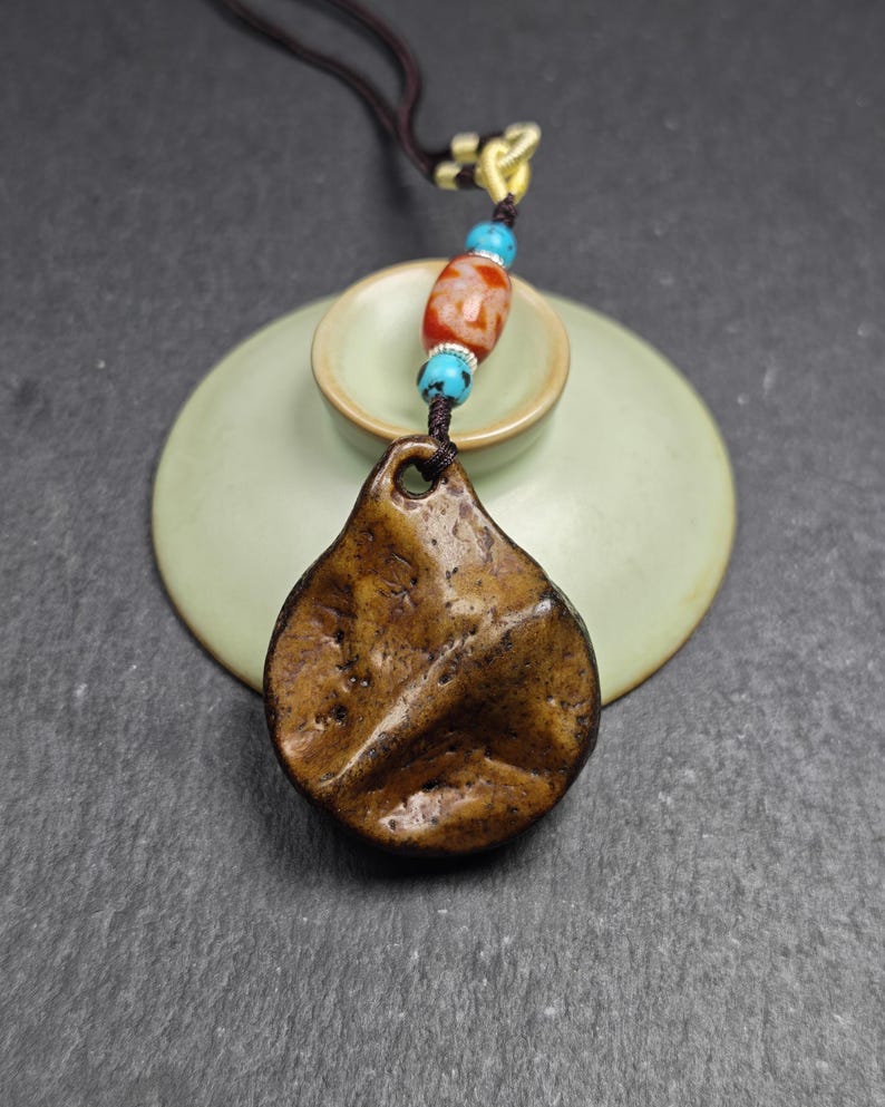 Authentic Kapala Amulet - Cross Vajra Charm - Tibetan Protective Pendant - Decad - Tibetan Buddhist amulet, close-up detail