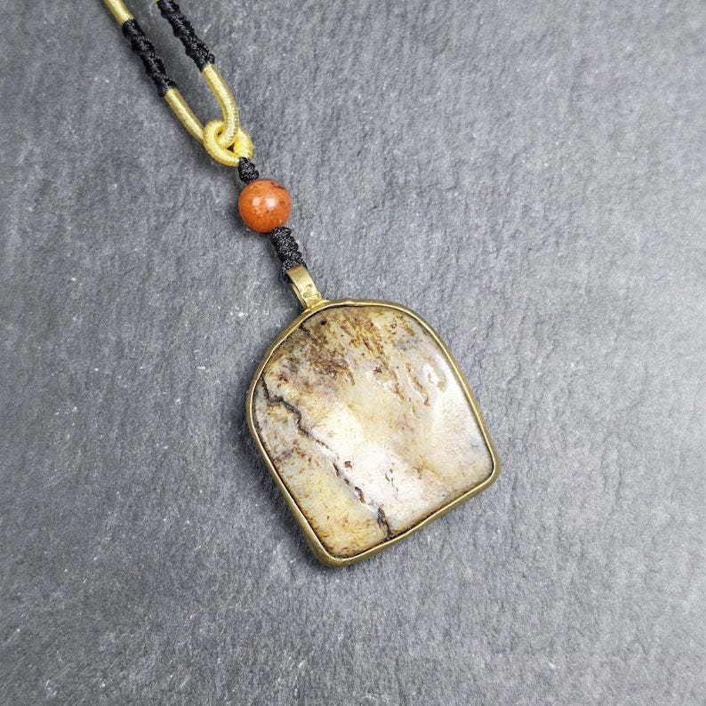 Antique Shield-shaped Kapala Amulet 36mm - Tibetan Buddhist amulet, front view