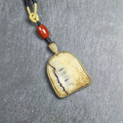 Shield-shaped Kapala Amulet - 33mm - Tibetan Buddhist amulet, front view