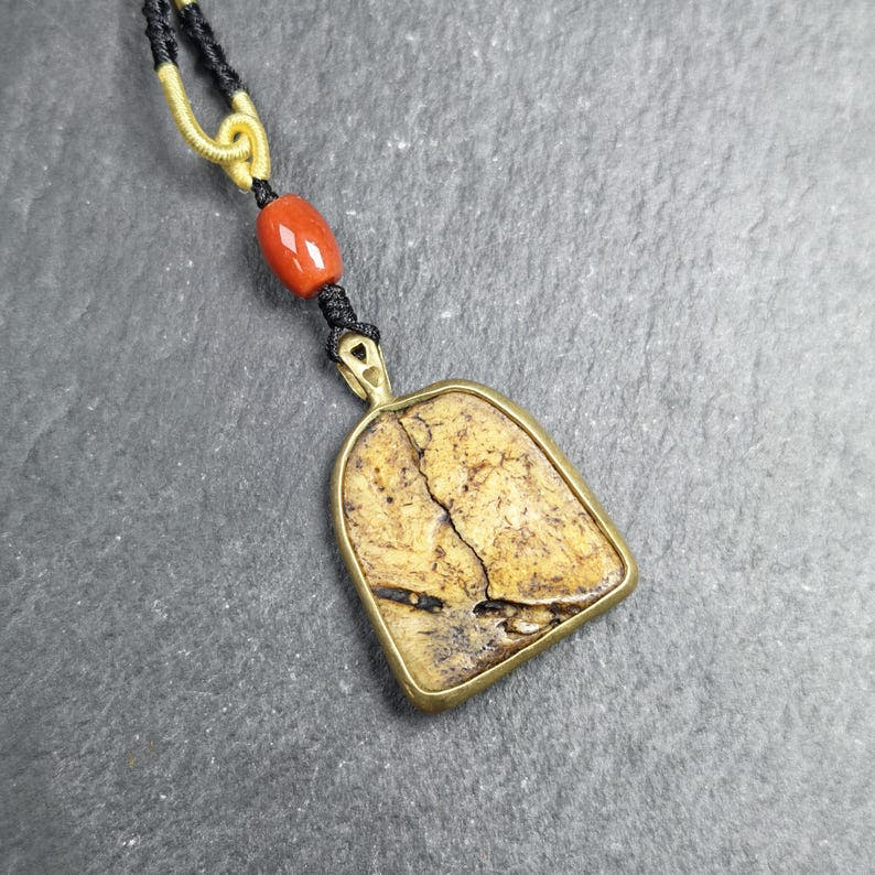 Shield-shaped Kapala Amulet - 33mm - Tibetan Buddhist amulet, detailed view