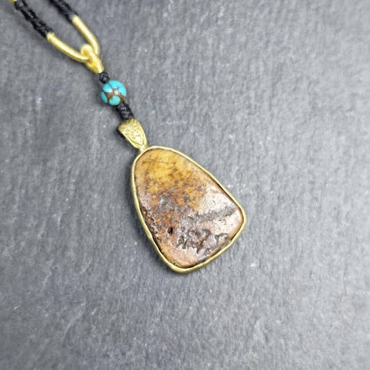 Shield-shaped Kapala Amulet - 33mm - Tibetan Buddhist amulet, front view