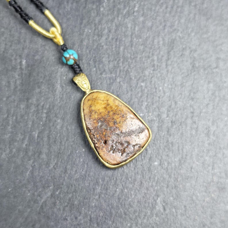 Shield-shaped Kapala Amulet - 33mm - Tibetan Buddhist amulet, front view