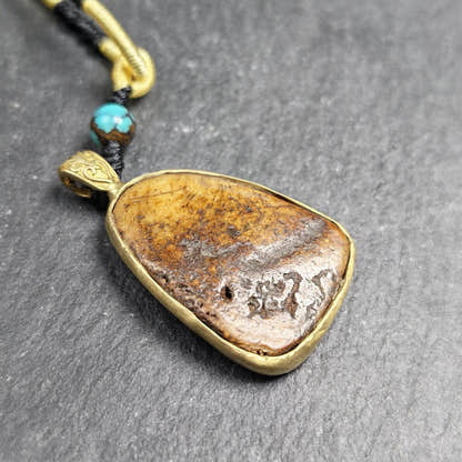 Shield-shaped Kapala Amulet - 33mm - Tibetan Buddhist amulet, close-up detail