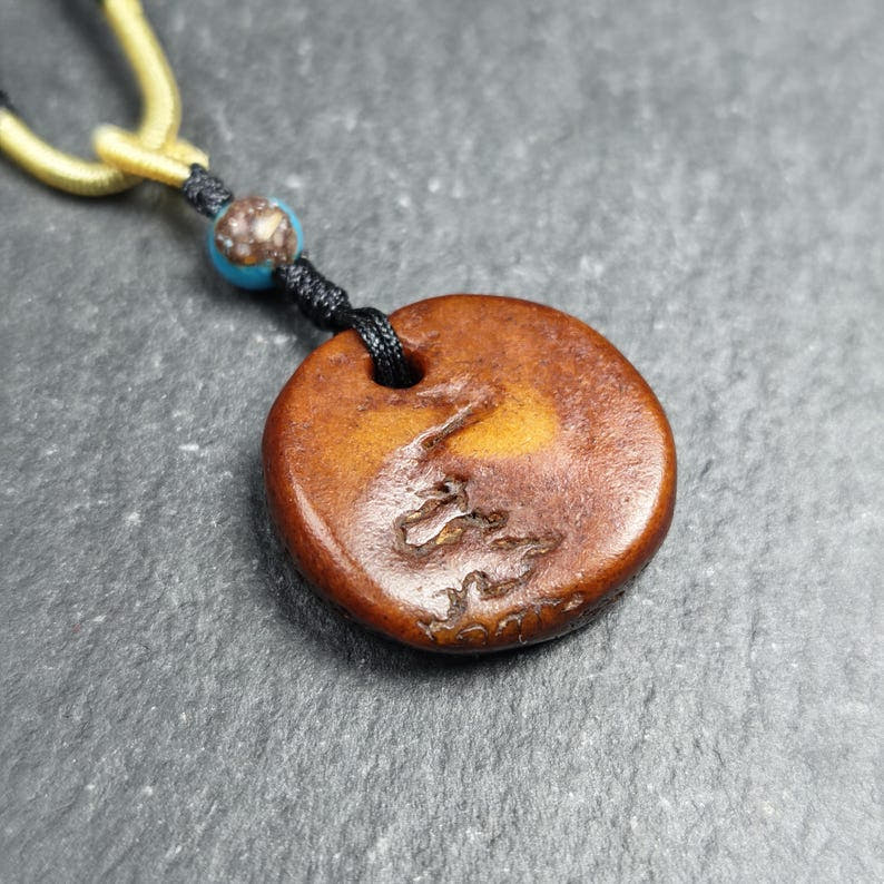 Antique Triangle Kapala Amulet 44mm - Tibetan Buddhist amulet, front view
