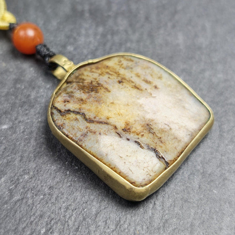 Antique Shield-shaped Kapala Amulet 36mm - Tibetan Buddhist amulet, close-up detail
