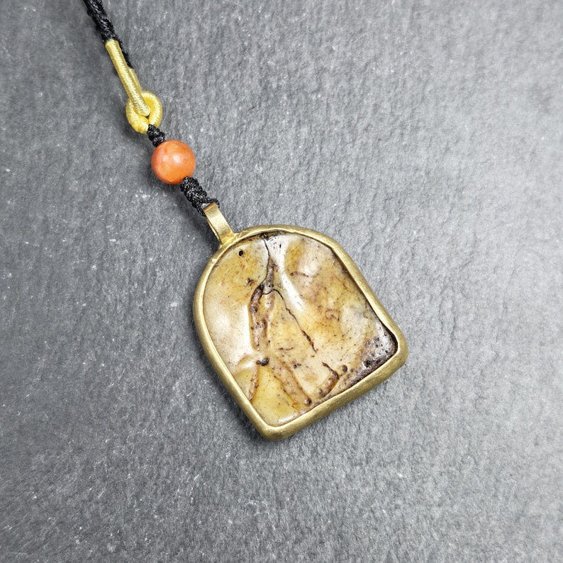 Antique Shield-shaped Kapala Amulet 36mm - Tibetan Buddhist amulet, detailed view