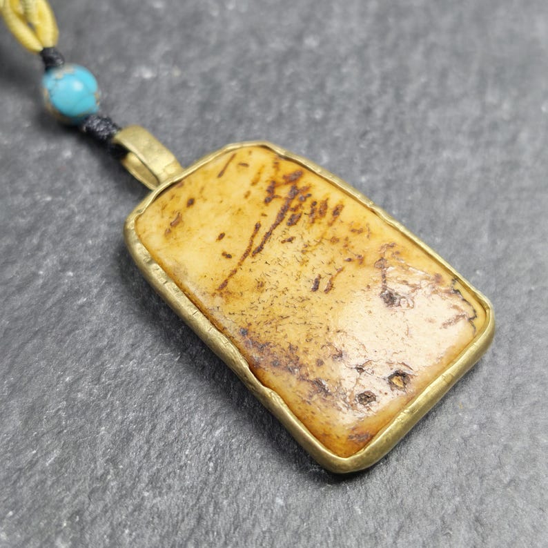 Antique Shield-shaped Kapala Amulet - 40mm - Tibetan Buddhist amulet, close-up detail
