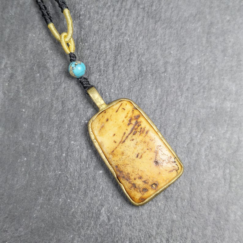 Antique Shield-shaped Kapala Amulet - 40mm - Tibetan Buddhist amulet, front view