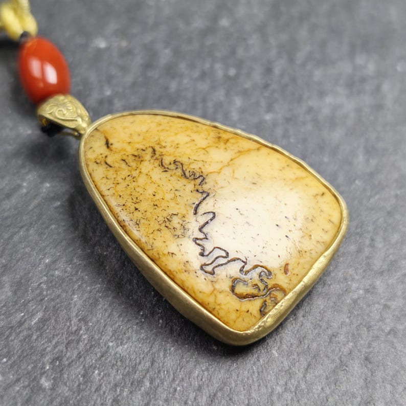 Shield-shaped Kapala Amulet - 37mm - Tibetan Buddhist amulet, close-up detail