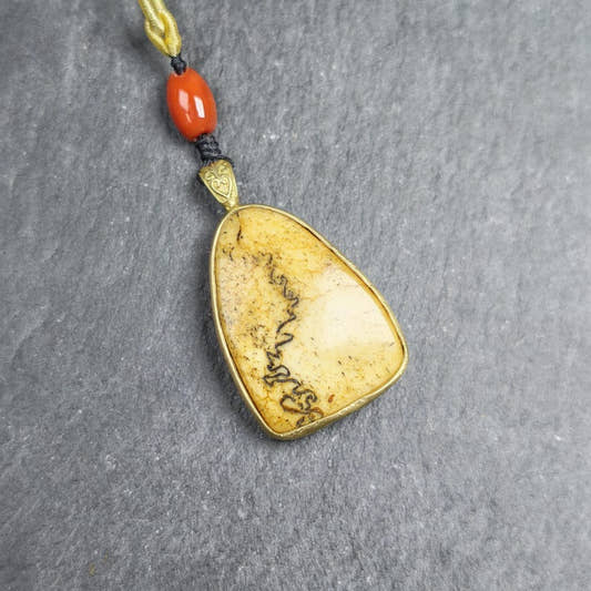 Shield-shaped Kapala Amulet - 37mm - Tibetan Buddhist amulet, front view