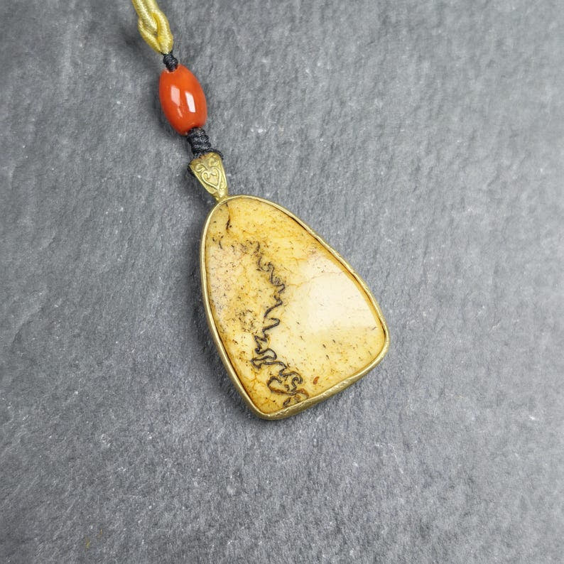 Shield-shaped Kapala Amulet - 37mm - Tibetan Buddhist amulet, front view