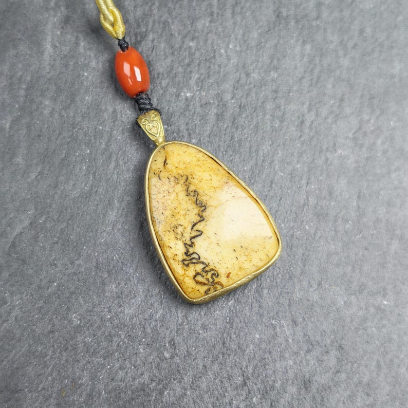 Shield-shaped Kapala Amulet - 37mm - Tibetan Buddhist amulet, front view