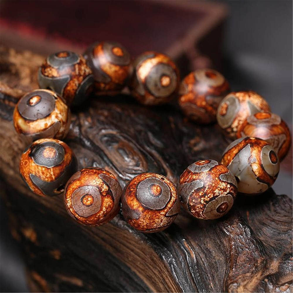 3 Eyes Dzi Bead Bracelet - Tibetan Buddhist mala beads, front view