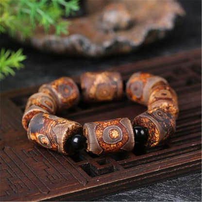 3 Eyes Dzi Bead Bracelet - Tibetan Buddhist mala beads, close-up detail