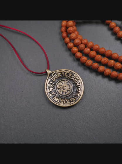 This Om badge amulet was collected from Yushu City Tibet,about 50 years old. It is round shape,made of lima brass, 1.58 inches,carved with mantra of chenrezig OM MANI PADME HUM. You can make it into a necklace, or a keychain, pendant